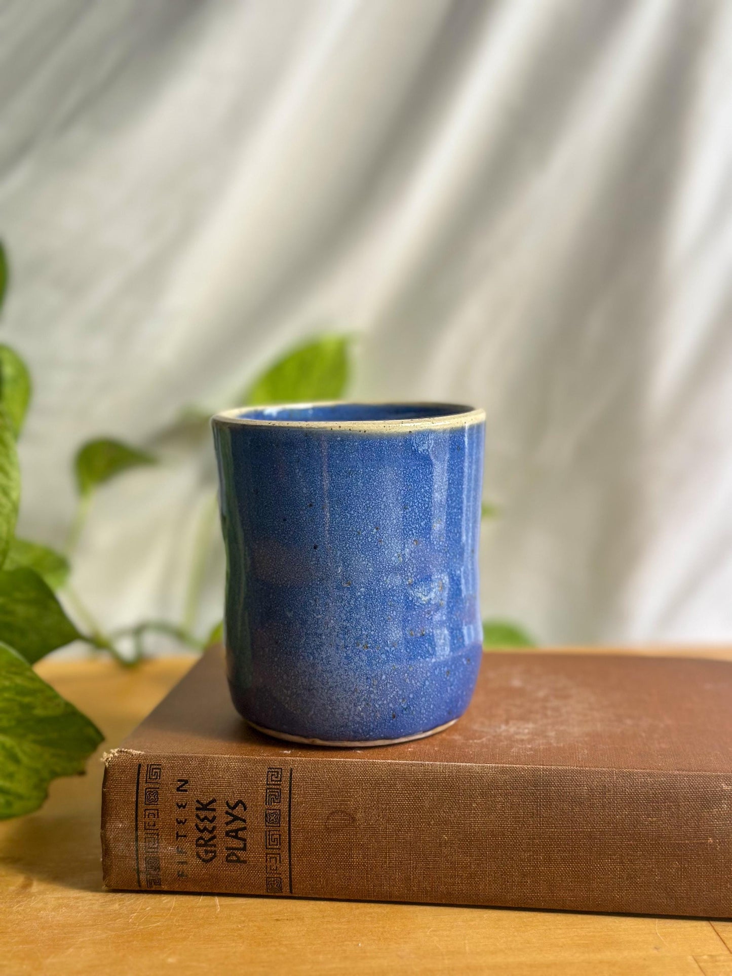 Warm Blue Pottery Cup with Unique Rim