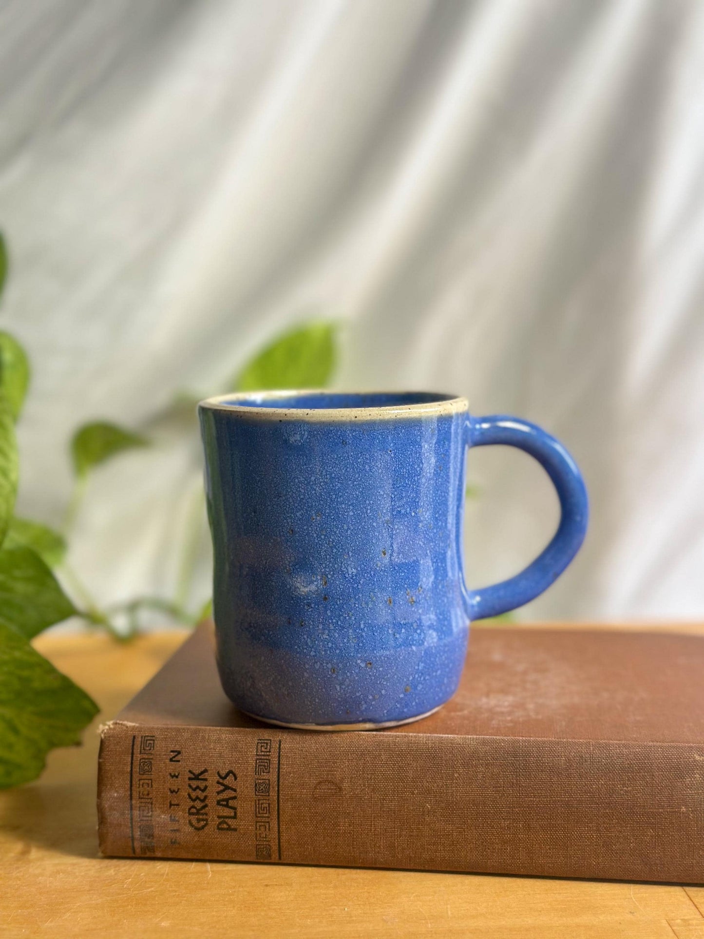 Warm Blue Pottery Cup with Unique Rim