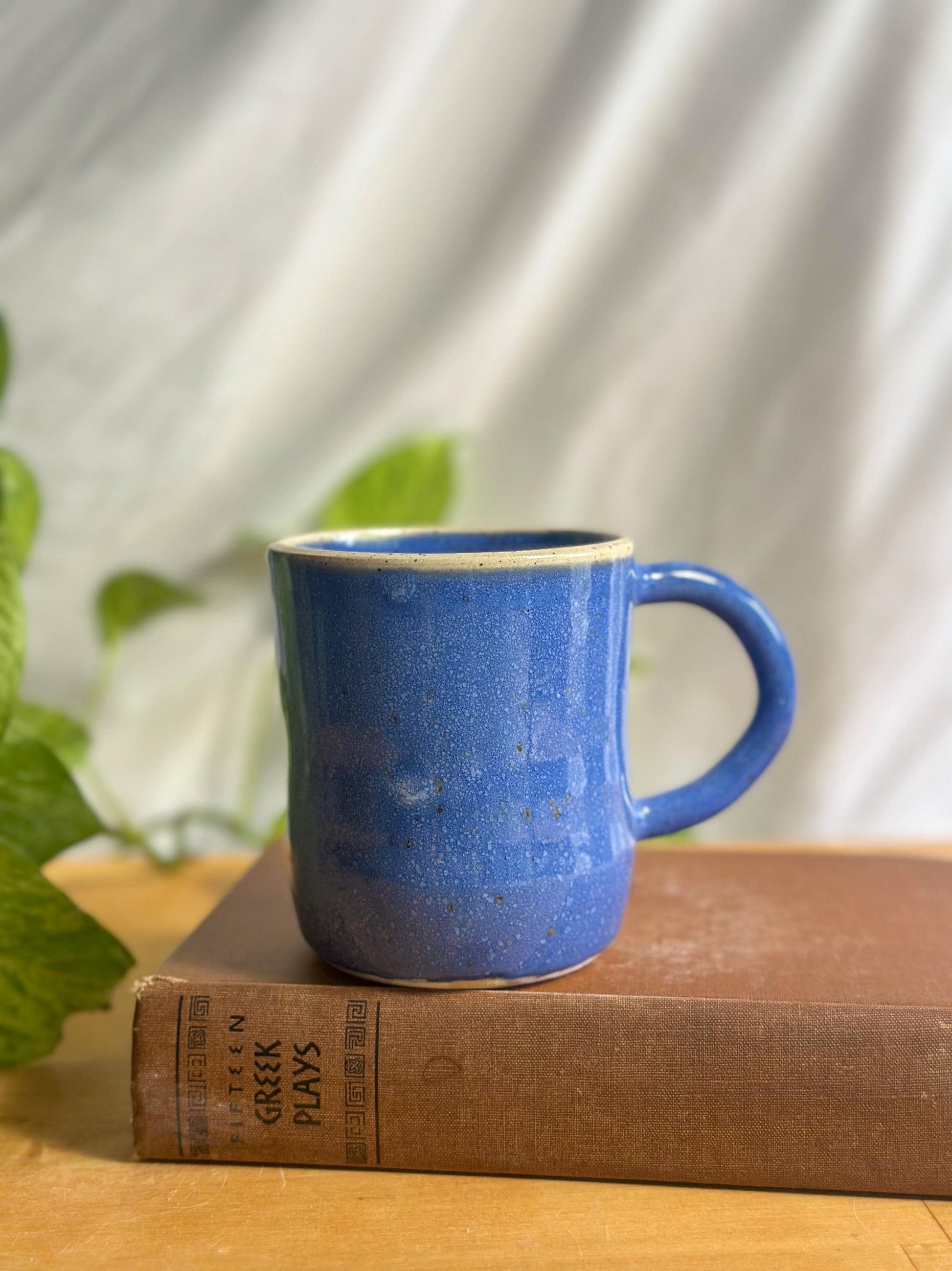 Warm Blue Pottery Cup with Unique Rim