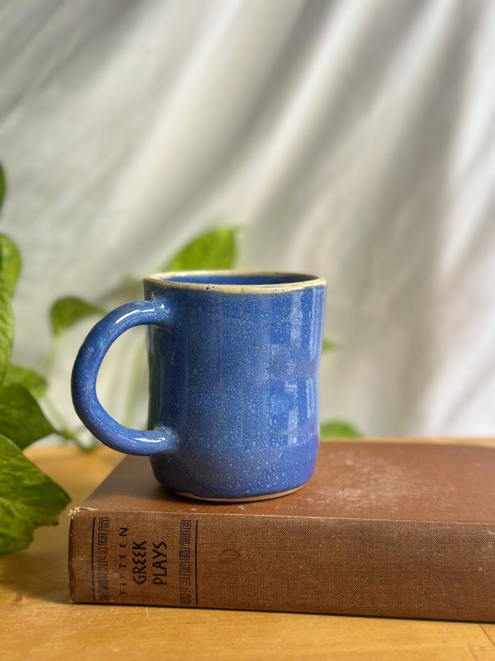 Warm Blue Pottery Cup with Unique Rim