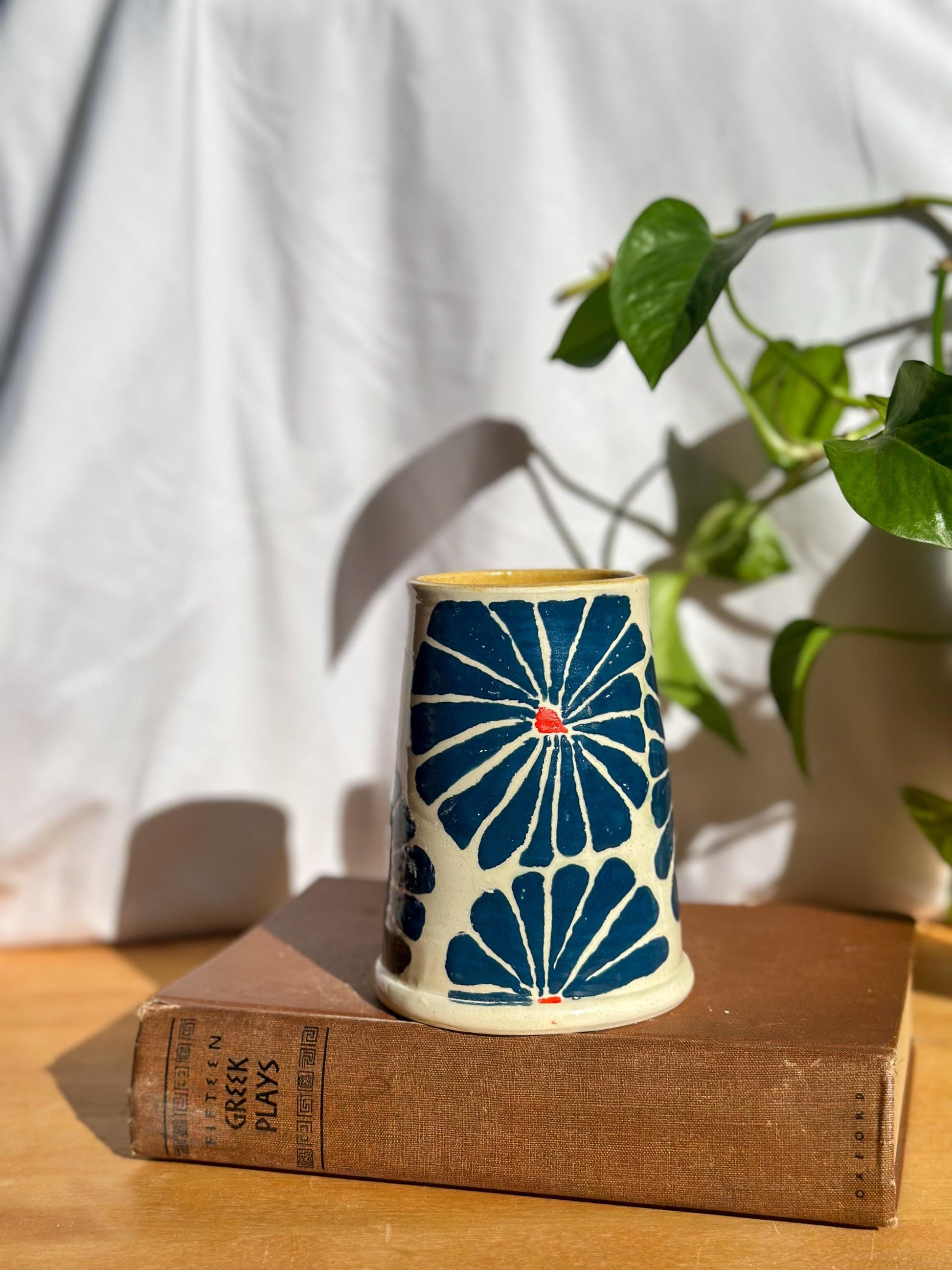 blue and yellow stamp tankard