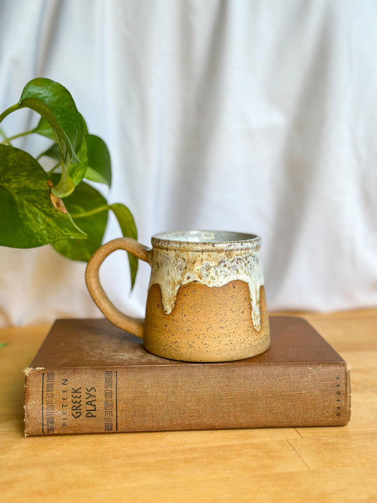 white and brown ceramic mug